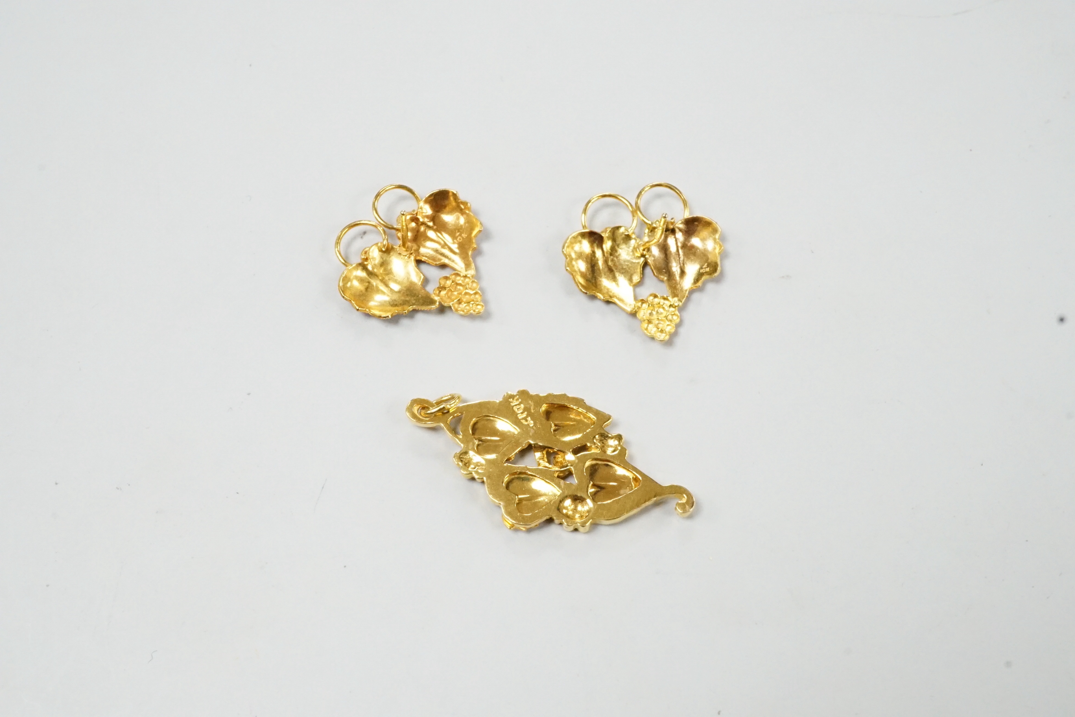 A modern three colour 10k leaf pendant, 31mm and a pair of matching earrings (no butterflies), 5.1 grams.